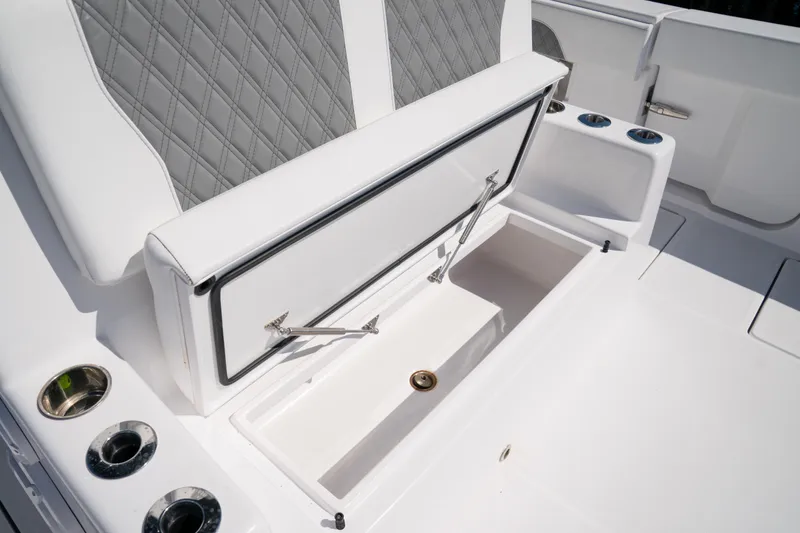 Slide: The Image of Luxury seating and storage on 2025 Front Runner 43 Catamaran, featuring quilted upholstery. - 57