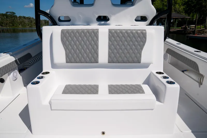 Slide: The Image of Luxury seating on 2025 Front Runner 43 Catamaran with quilted gray upholstery. - 59