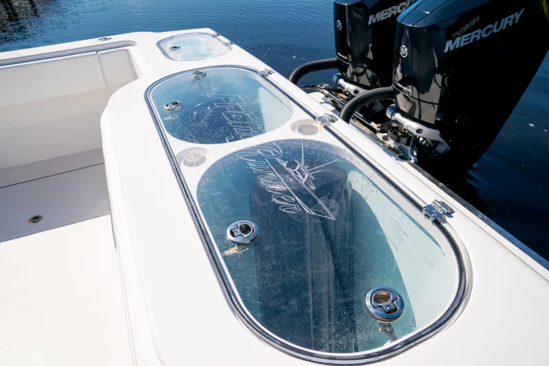 Slide: The Image of 2025 Front Runner 43 Catamaran with Mercury engines, featuring a sleek livewell design. - 63