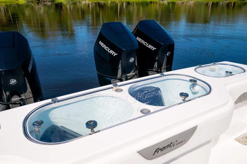 Slide: The Image of 2025 Front Runner 43 Catamaran with Mercury Verado engines on a calm lake. - 64