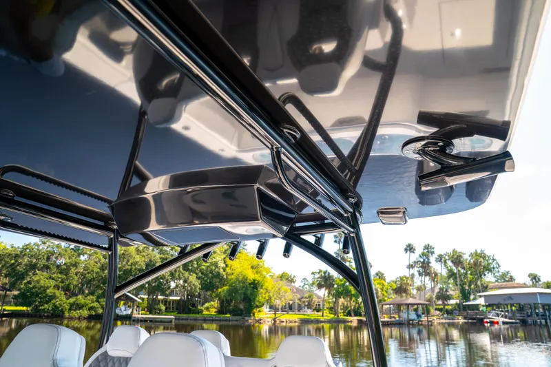 Slide: The Image of 2025 Front Runner 43 Catamaran's sleek roof design with scenic waterfront backdrop. - 7