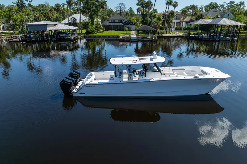 Slide: The Image of 2025 Front Runner 43 Catamaran on calm water, surrounded by lush greenery and docks. - 78