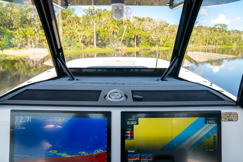 Slide: The Image of Cockpit view of 2025 Front Runner 43 Catamaran with advanced navigation displays. - 8