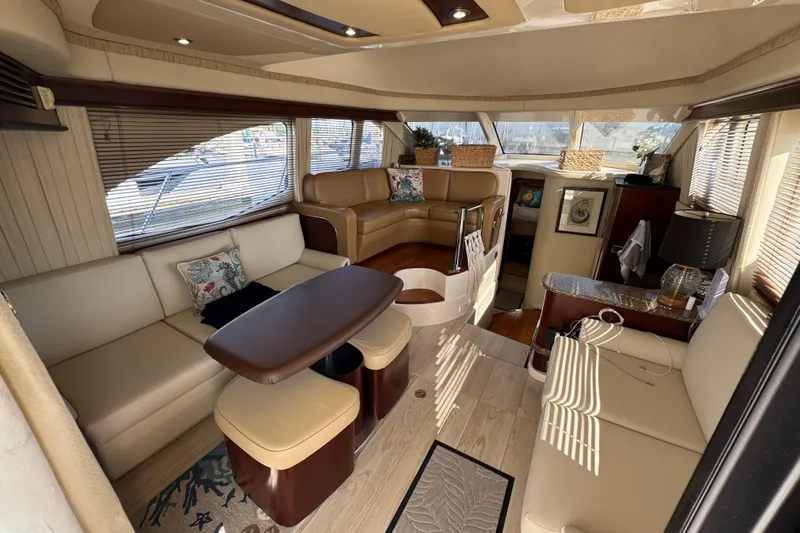Slide: The Image of Luxurious interior of a 2006 Sea Ray 44 Sedan Bridge yacht with elegant seating and decor. - 12