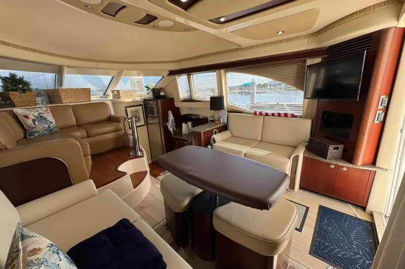 Slide: The Image of Luxurious interior of a 2006 Sea Ray 44 Sedan Bridge yacht with elegant seating and decor. - 14