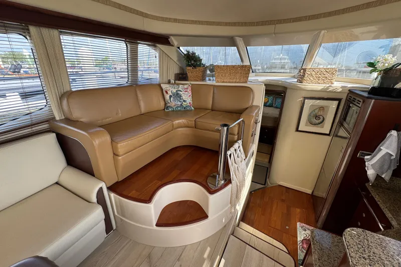 Slide: The Image of Luxurious interior of a 2006 Sea Ray 44 Sedan Bridge yacht with leather seating. - 15