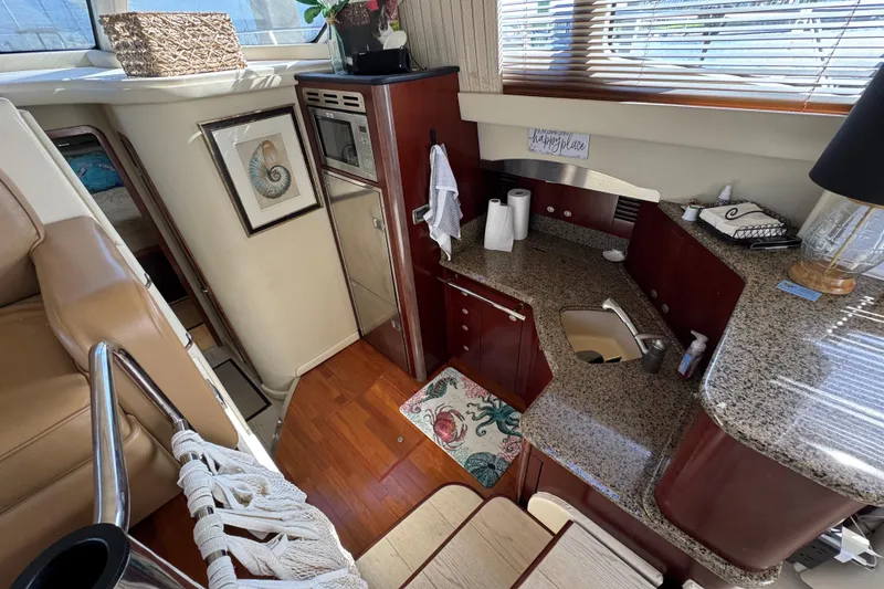 Slide: The Image of Luxurious 2006 Sea Ray 44 Sedan Bridge yacht interior with modern kitchen amenities. - 17