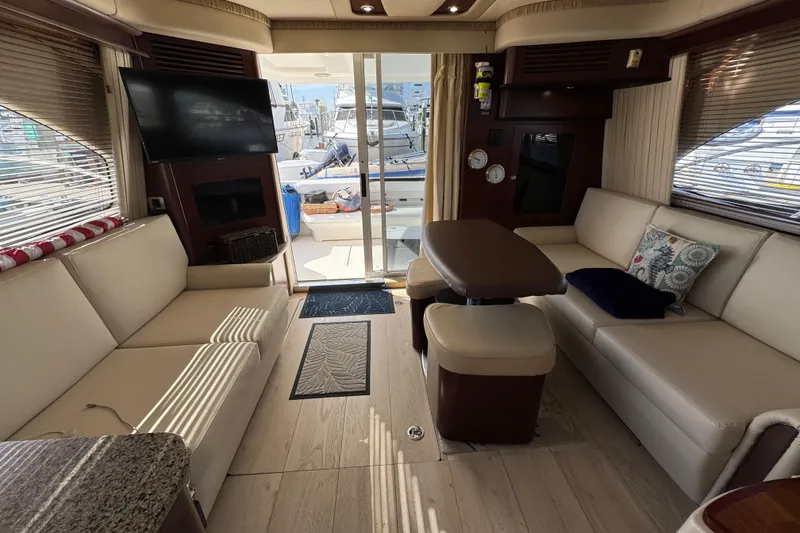 Slide: The Image of Luxurious interior of 2006 Sea Ray 44 Sedan Bridge yacht with elegant seating and decor. - 18
