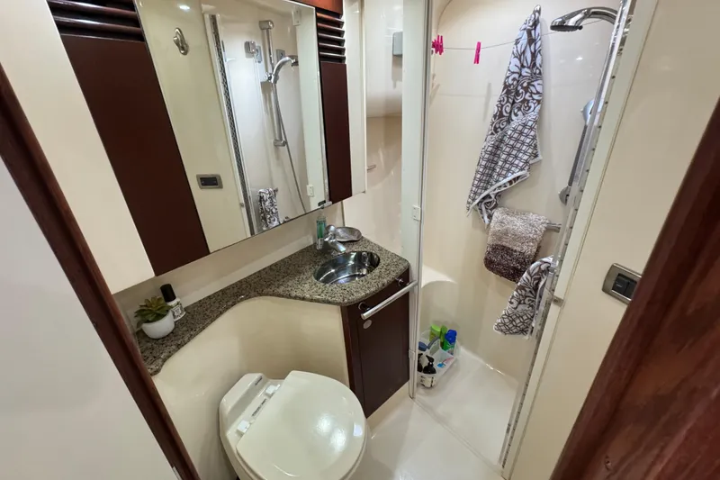 Slide: The Image of Luxurious bathroom in 2006 Sea Ray 44 Sedan Bridge yacht with shower and vanity. - 22