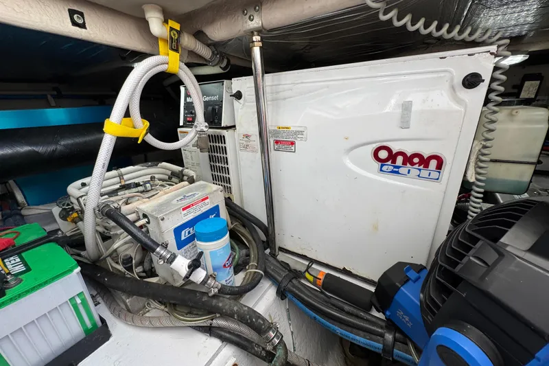 Slide: The Image of Engine room of 2006 Sea Ray 44 Sedan Bridge with Onan generator and equipment. - 29