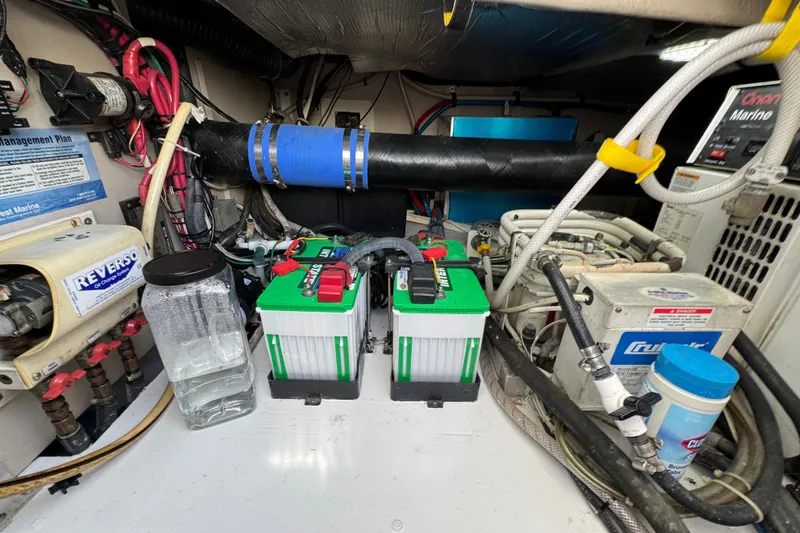 Slide: The Image of Engine room of a 2006 Sea Ray 44 Sedan Bridge with batteries and equipment. - 30