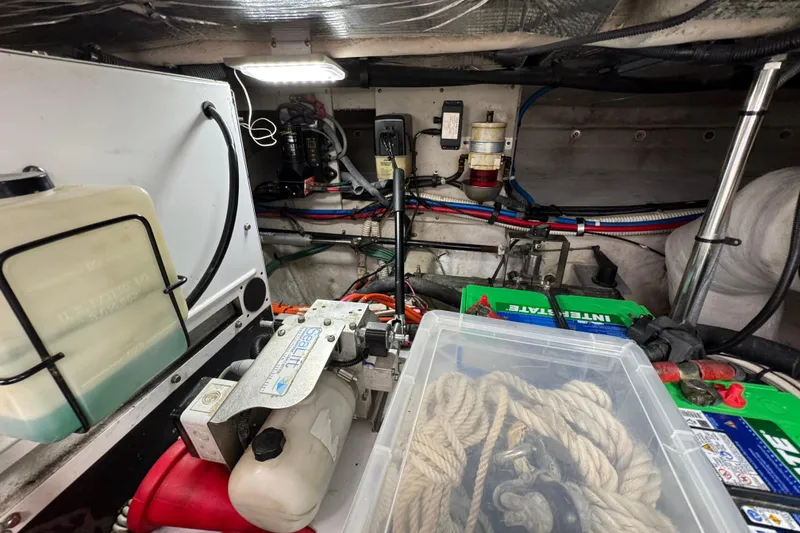 Slide: The Image of Engine room of a 2006 Sea Ray 44 Sedan Bridge with equipment and ropes. - 31