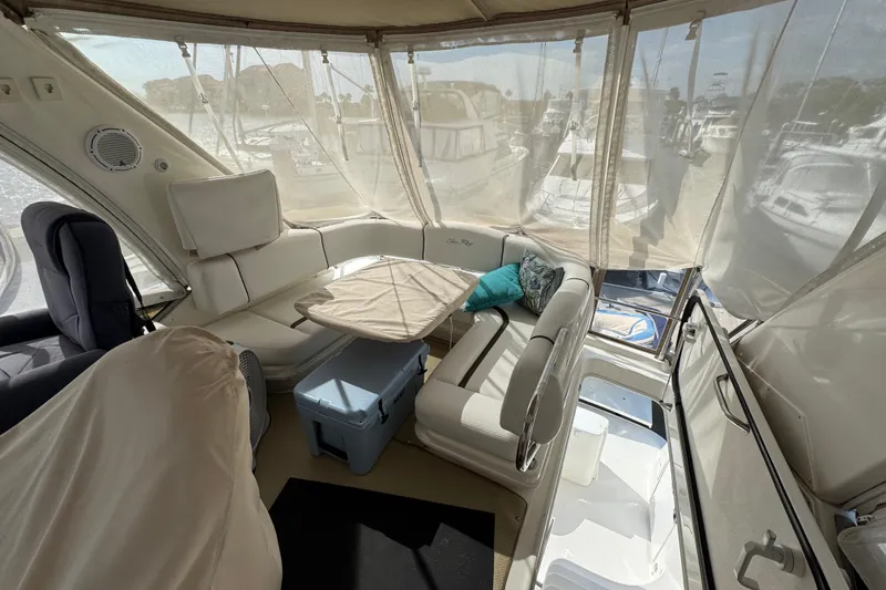 Slide: The Image of Interior of a 2006 Sea Ray 44 Sedan Bridge yacht with seating and table. - 32