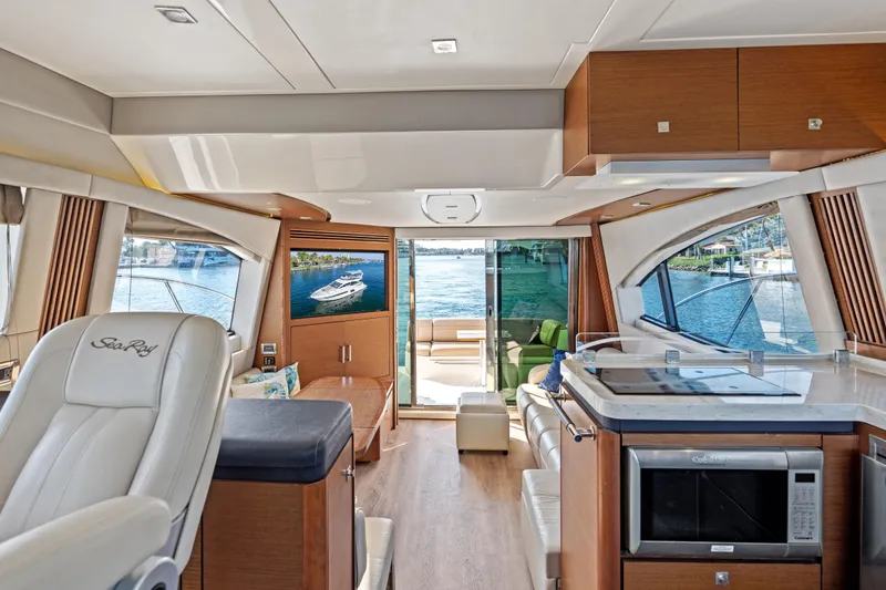 Slide: The Image of Luxurious interior of 2014 Sea Ray 510 Fly yacht with modern amenities and waterfront view. - 33