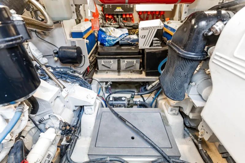 Slide: The Image of Engine room of a 2014 Sea Ray 510 Fly yacht, showcasing mechanical components and wiring. - 49