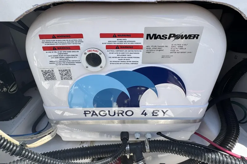 Slide: The Image of Paguro 4 EY generator in a 2005 Pro-Line 32 Express boat engine compartment. - 10