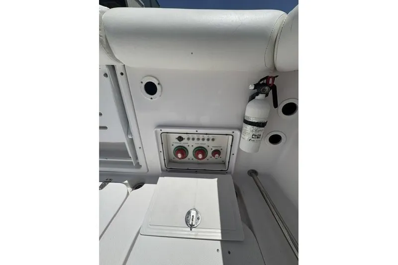 Slide: The Image of 2005 Pro-Line 32 Express boat interior with control panel and fire extinguisher. - 11