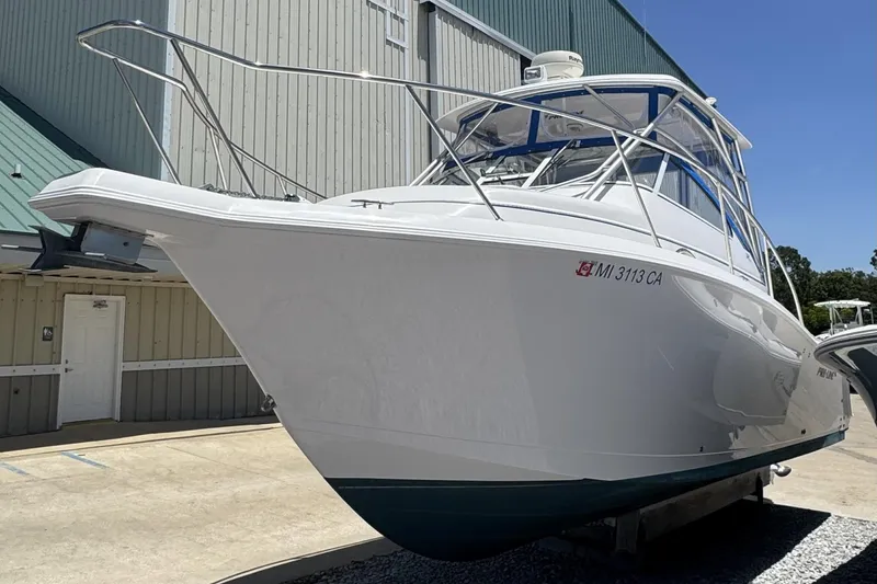 Slide: The Image of 2005 Pro-Line 32 Express boat displayed outdoors, showcasing sleek design and sturdy construction. - 4