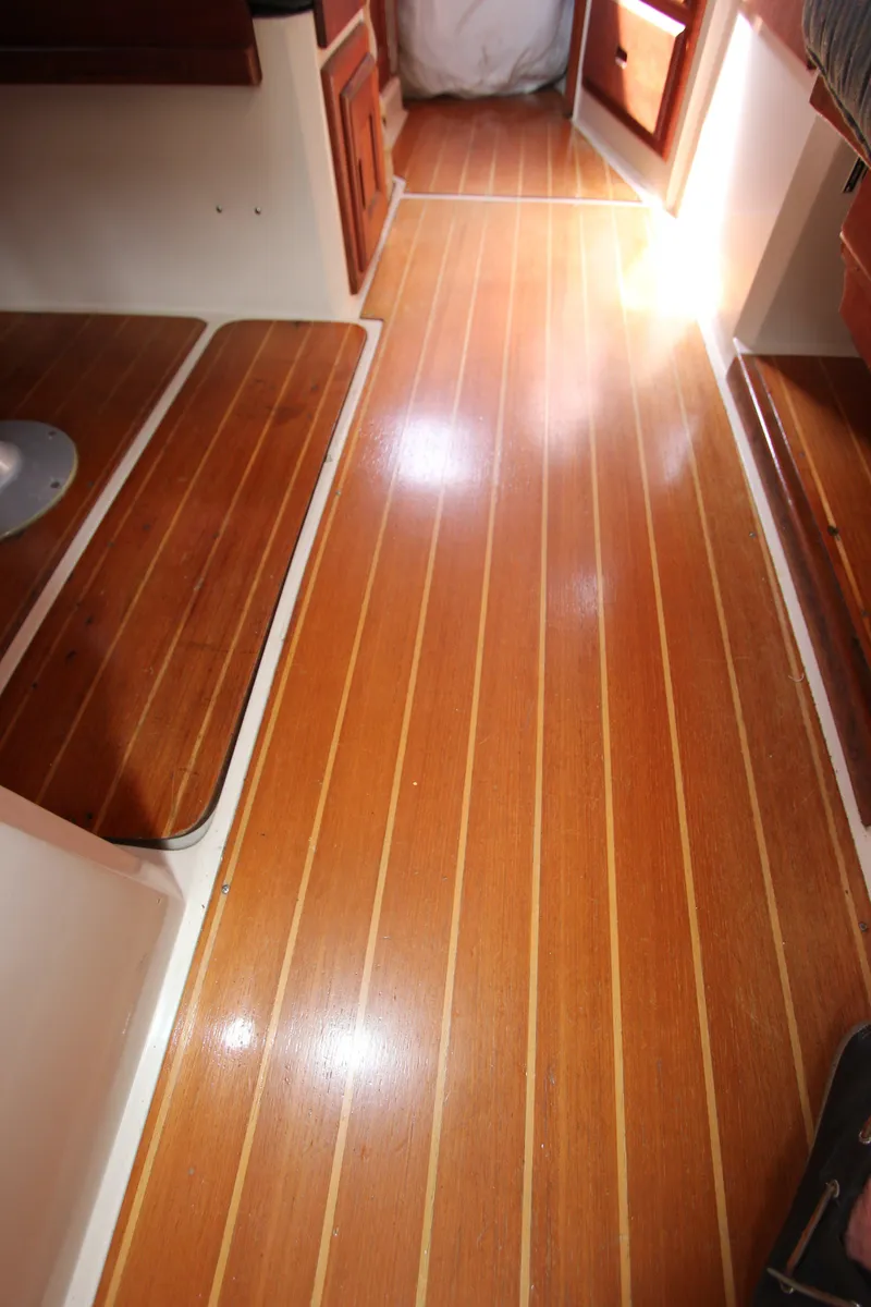 Slide: The Image of 1991 Catalina 36 sailboat interior with wooden flooring. - 18