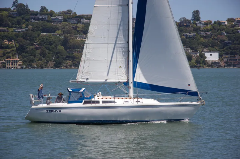 Slide: The Image of Sailing yacht Catalina 36, 1991 model, named Zephyr, cruising on a scenic lake. - 2