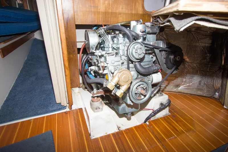 Slide: The Image of Engine compartment of a 1991 Catalina 36 sailboat, showcasing detailed mechanical components. - 20