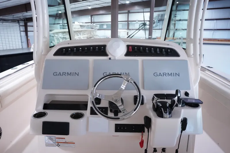 Slide: The Image of 2023 Grady-White Canyon 336 helm with Garmin displays and modern controls. - 12