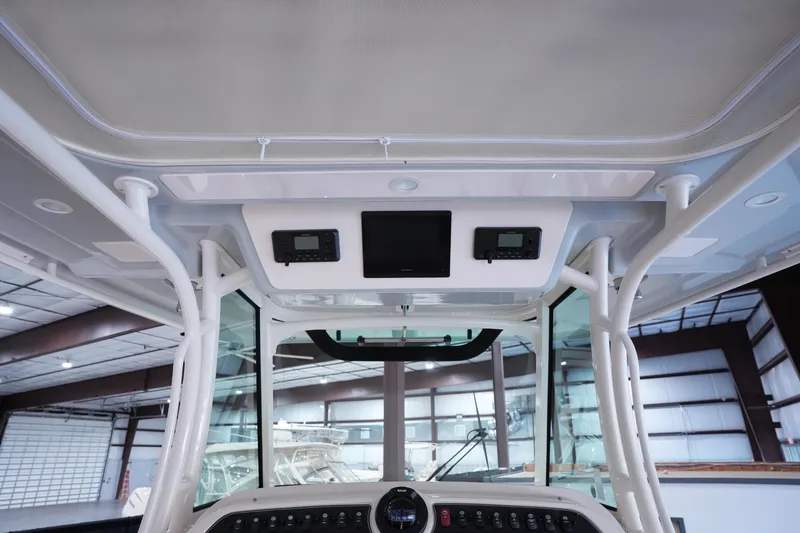 Slide: The Image of 2023 Grady-White Canyon 336 boat interior with modern dashboard and electronic controls. - 16