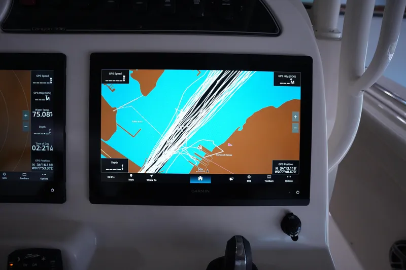 Slide: The Image of 2023 Grady-White Canyon 336 boat dashboard with Garmin navigation display. - 21