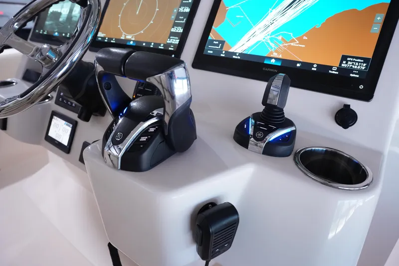Slide: The Image of 2023 Grady-White Canyon 336 helm with advanced navigation and control systems. - 22