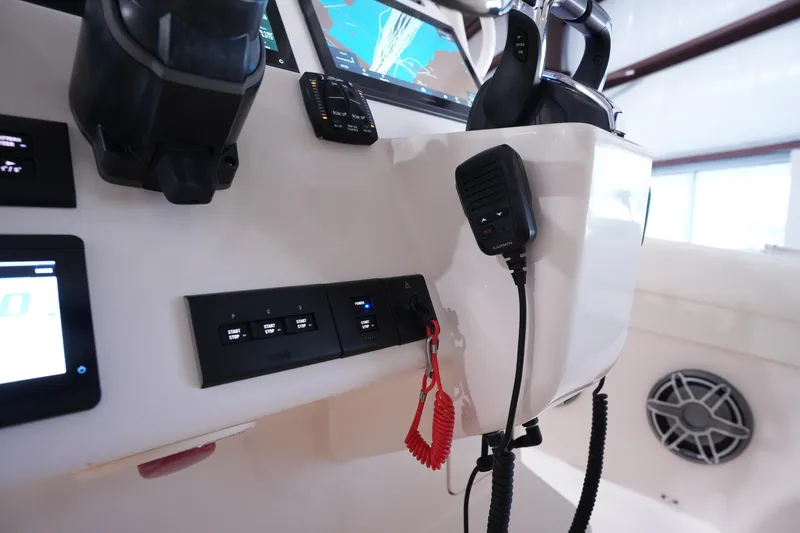 Slide: The Image of Control panel of 2023 Grady-White Canyon 336 boat with modern navigation equipment. - 23