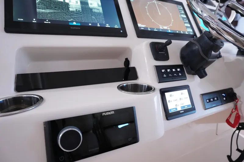 Slide: The Image of 2023 Grady-White Canyon 336 dashboard with advanced navigation and control systems. - 25