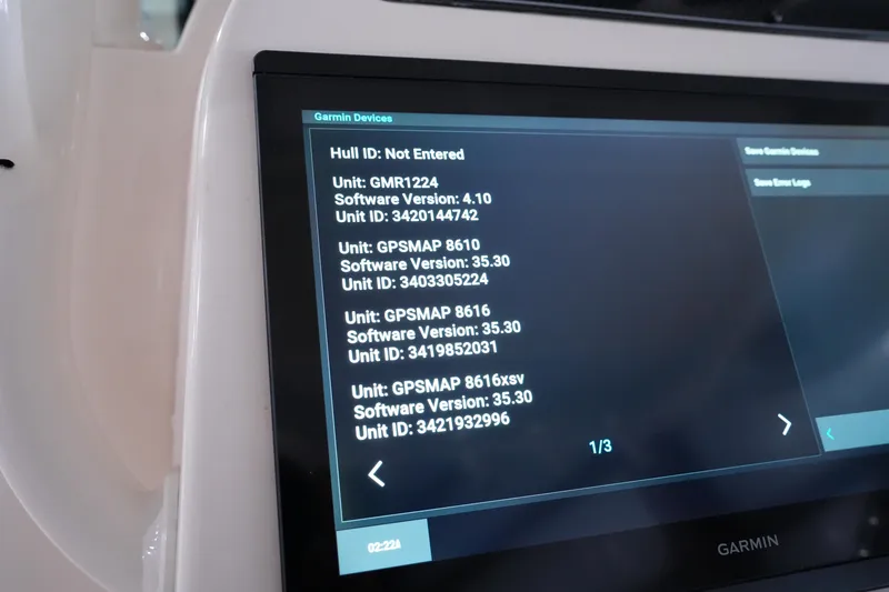 Slide: The Image of Garmin device display on 2023 Grady-White Canyon 336 boat, showing software versions and unit IDs. - 26