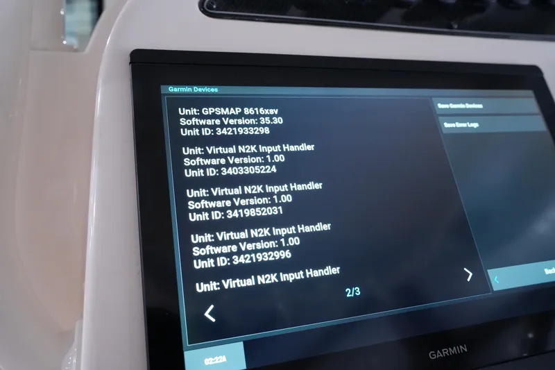 Slide: The Image of Garmin device display on 2023 Grady-White Canyon 336 boat, showing software versions and unit IDs. - 27