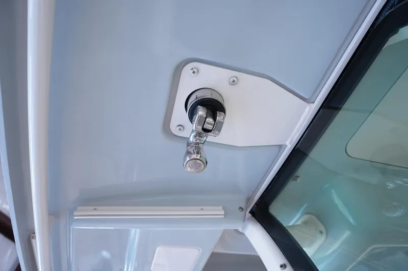 Slide: The Image of 2023 Grady-White Canyon 336 boat detail, featuring a chrome handle and sleek interior design. - 29
