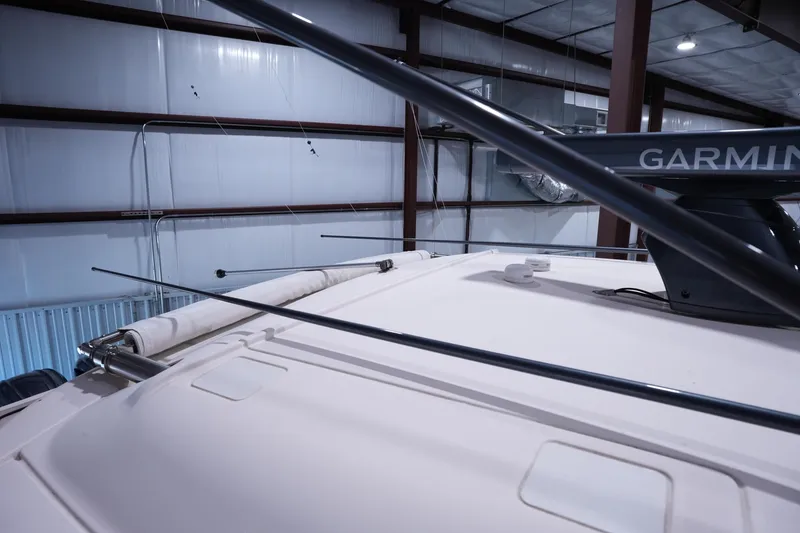 Slide: The Image of 2023 Grady-White Canyon 336 boat with Garmin radar in a warehouse setting. - 31