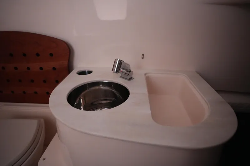 Slide: The Image of 2023 Grady-White Canyon 336 boat interior with sink and faucet. - 36