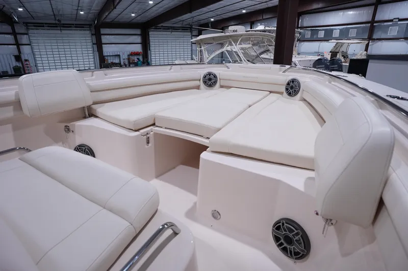 Slide: The Image of 2023 Grady-White Canyon 336 boat interior with plush seating and modern design. - 40