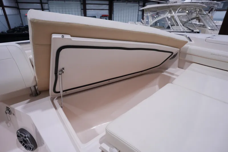Slide: The Image of 2023 Grady-White Canyon 336 boat interior storage compartment with cushioned seating. - 41