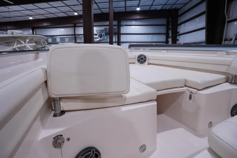 Slide: The Image of 2023 Grady-White Canyon 336 boat interior with cushioned seating and speaker system. - 42