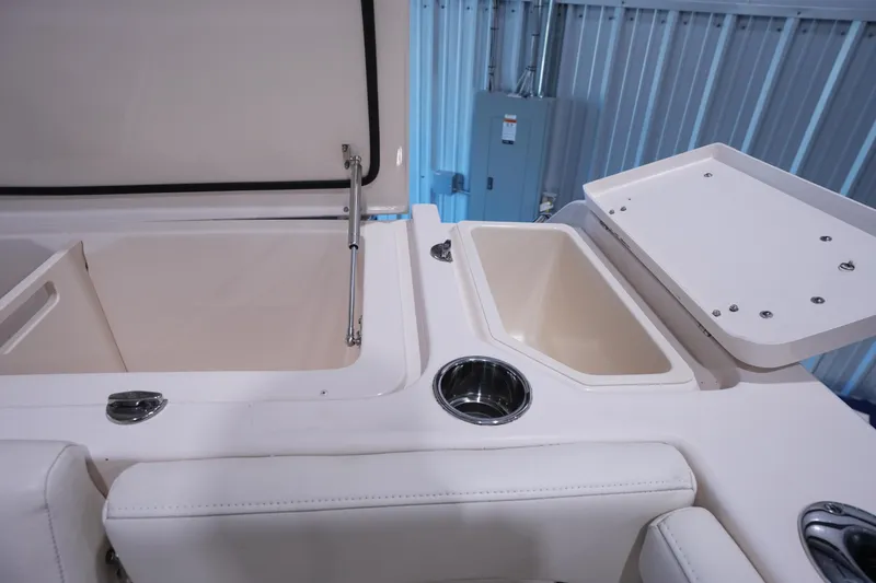 Slide: The Image of 2023 Grady-White Canyon 336 boat interior with storage compartments and cup holder. - 5