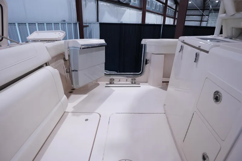 Slide: The Image of 2023 Grady-White Canyon 336 boat interior, featuring spacious deck and storage compartments. - 7