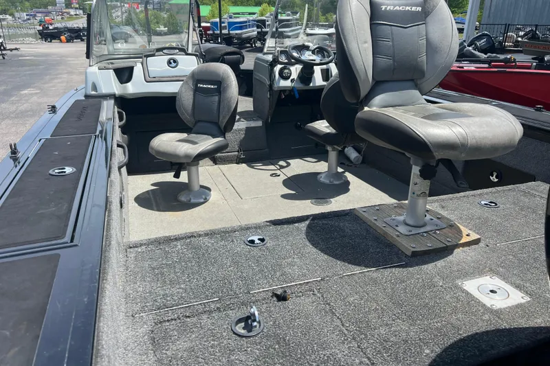 Slide: The Image of 2017 Tracker Targa V-18 WT boat interior with seating and steering console. - 4