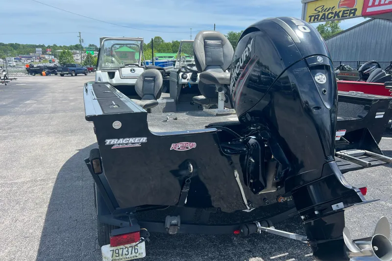 Slide: The Image of 2017 Tracker Targa V-18 WT boat with Mercury outboard motor in a dealership lot. - 7