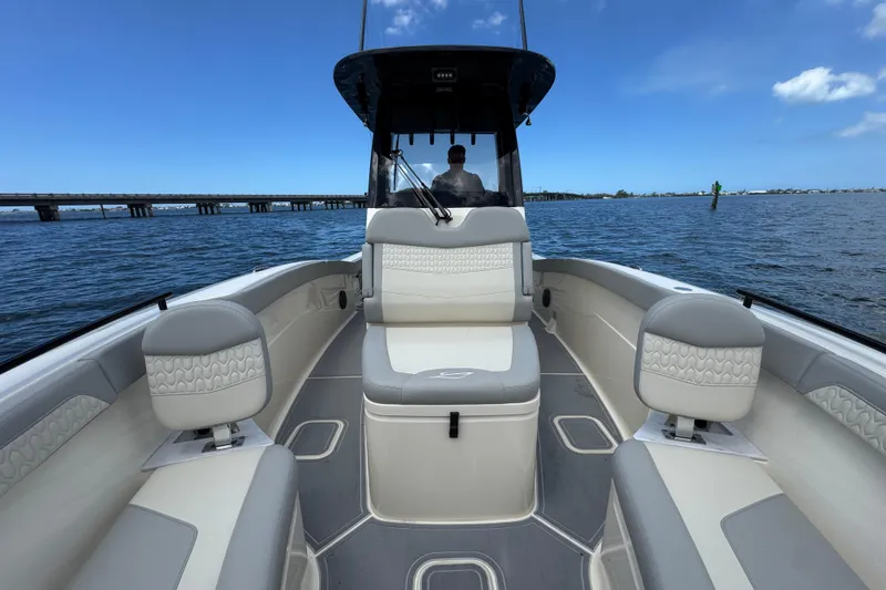 Slide: The Image of 2026 Scout 260 LXF boat interior with luxurious seating on open water. - 11