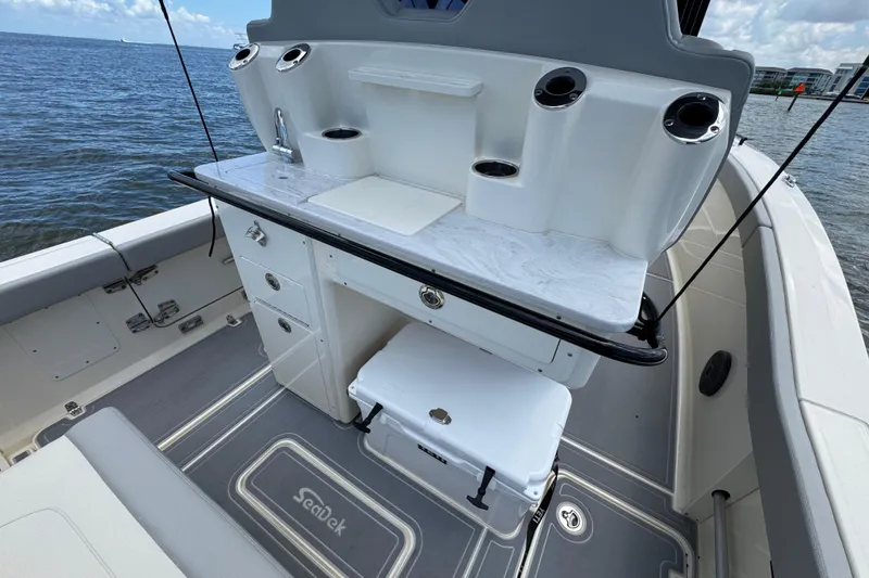 Slide: The Image of 2026 Scout 260 LXF boat interior with sleek design, featuring a modern console and storage. - 26