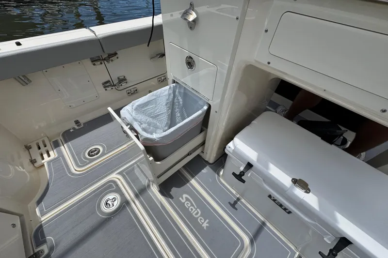 Slide: The Image of Interior of 2026 Scout 260 LXF boat with storage and cooler features. - 29