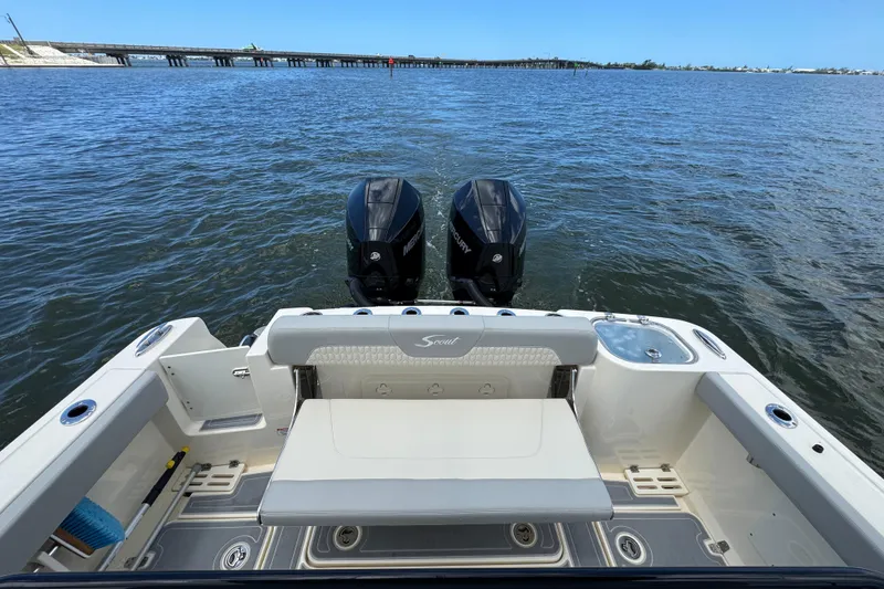 Slide: The Image of 2026 Scout 260 LXF boat with dual Mercury engines on open water. - 30