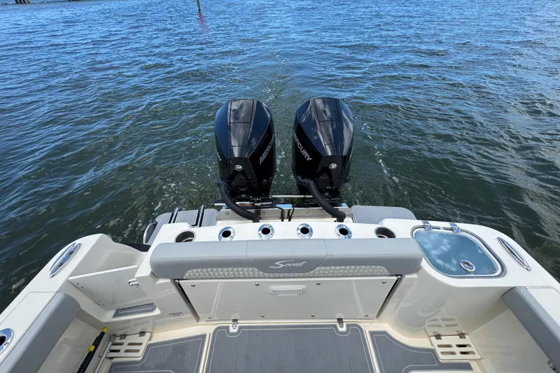 Slide: The Image of 2026 Scout 260 LXF boat with dual Mercury engines on open water. - 33