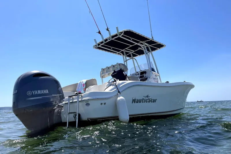 The Image of 2017 NauticStar 20 XS boat with Yamaha engine on open water under clear blue sky. - 0