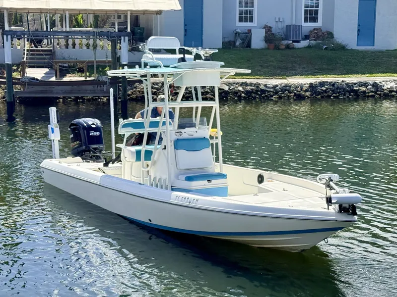 The Image of 2017 Skeeter SX230 boat on calm water near dock. - 0
